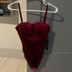 Deep wine red body suit, XS never worn.